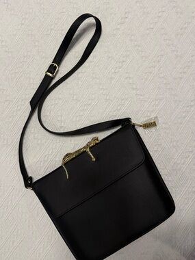 Nima Black Crossbody with Gold Hardware and Logo Charm